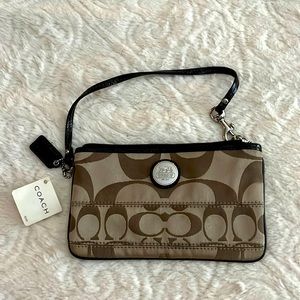 Authentic COACH signature wristlet tan w/patent leather trim. NWT